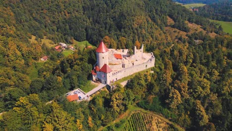 Stunning-4K-drone-footage-of-a-castle-Žovnek-located-northeast-pf-Braslovče,-Slovenia