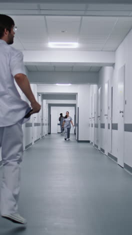 medical staff walking through hospital corridor