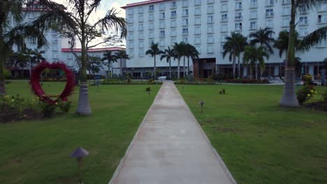 Pull-in-drone-shot-of-beachfront-and-garden-area-of-Crown-Plaza-Resort