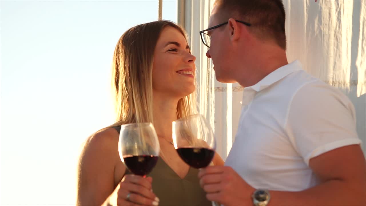 Couple Kissing on a Sailboat at Sunset