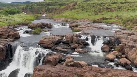 aerial hd slow motion 50fps drone footage of the surrounding landscape and small waterfalls along the blyde river in graskop, mpumalanga, south africa