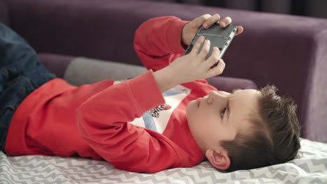 preschooler playing mobile phone