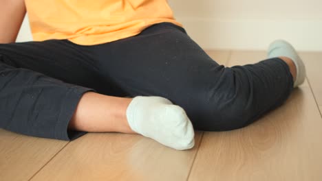 child sitting on the floor