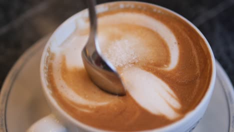 close-up of latte art with sugar