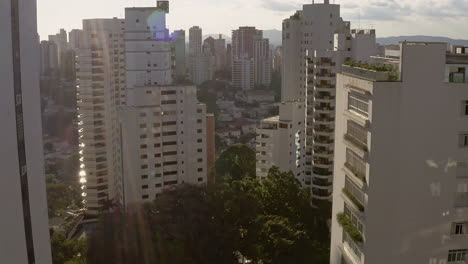 Drone-Aerial-Shoot-of-the-Cityscape-of-a-Big-Metropolis-Passing-Through-Big-Buildings-on-Sao-Paulo-city,-Brazil,-Dolly-In