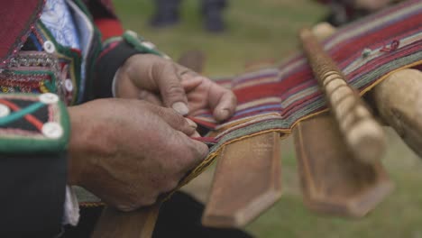 macro of natural weaving in peru on a traditional loom