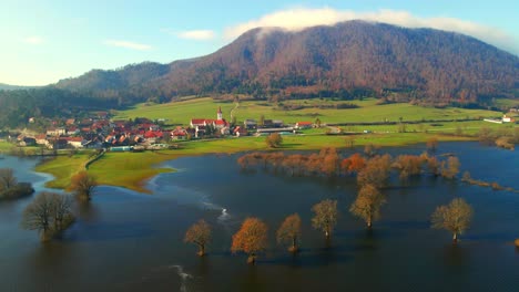 aerial 4k drone footage of a planina plain , slovenia