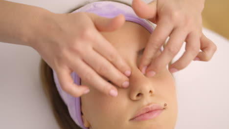 woman receiving face massage