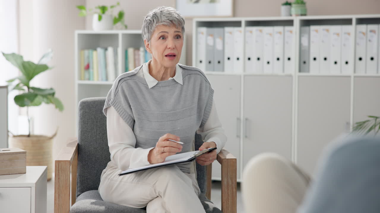 Therapist talking with patient during counseling session