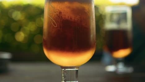 sunlit pint of beer in a cozy cafe ambiance