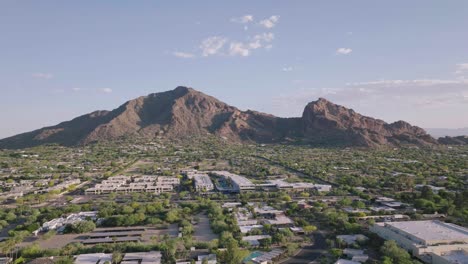 aerial tilt up shot of paradise valley in arizona, looking at camelback mountain on a clear sunny day in usa