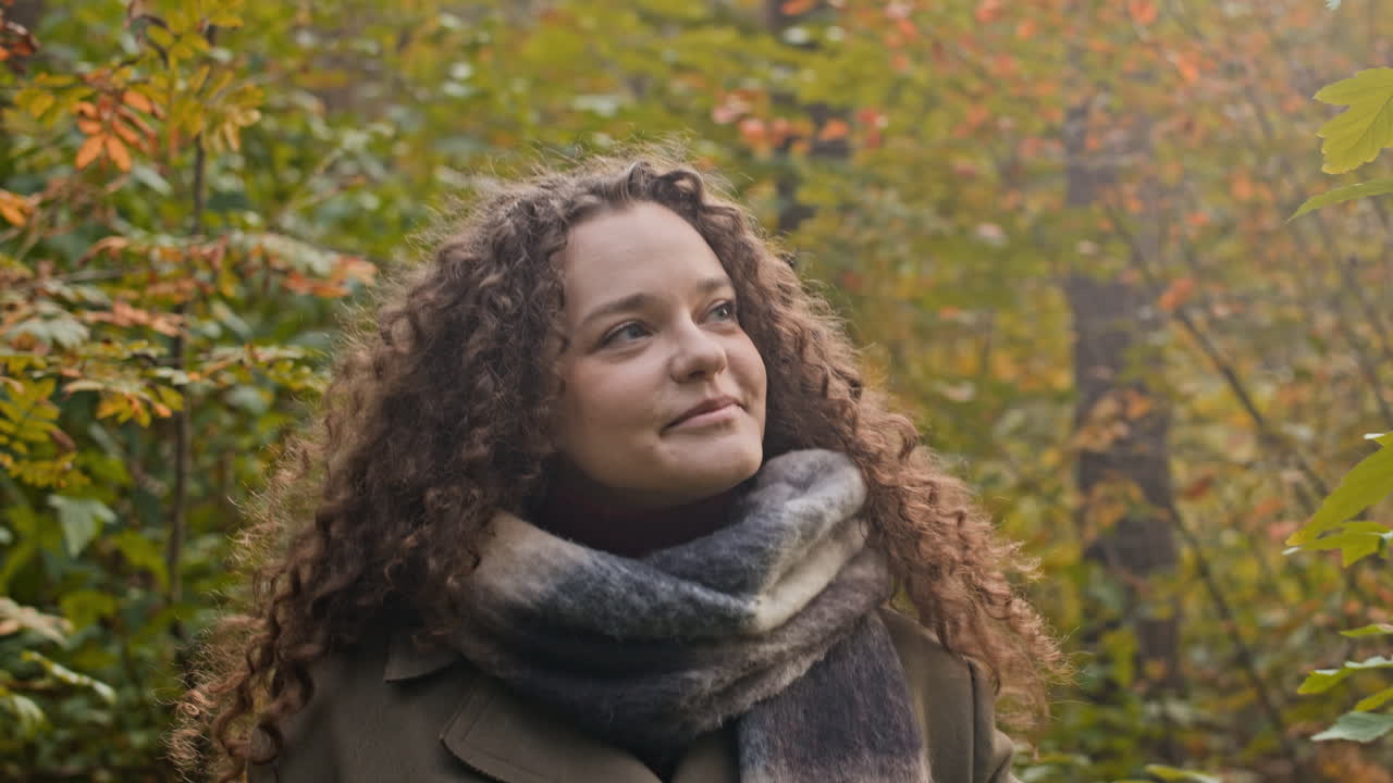 Woman with Curly Hair in Autumn