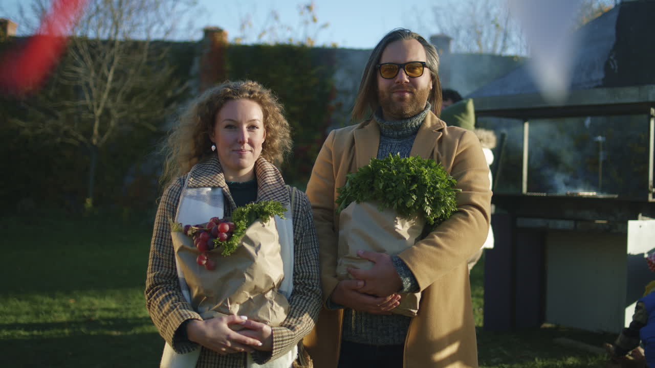 Young Adult Couple Standing on a Camping Trip Standing Near a Lake Looking at Camera Young Adult Couple Standing on a Camping Trip Standing Near a Lake Looking at Camera Close up Lake District Uk