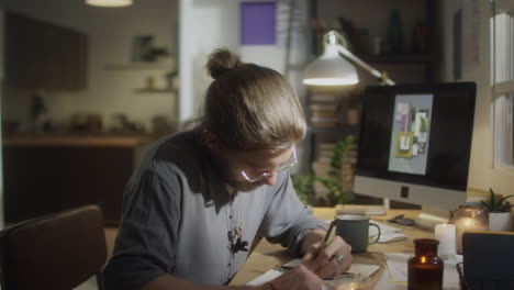 artist drawing at comfortable home workplace