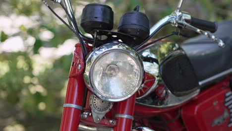 retro motorcycle headlight and handlebar - close up