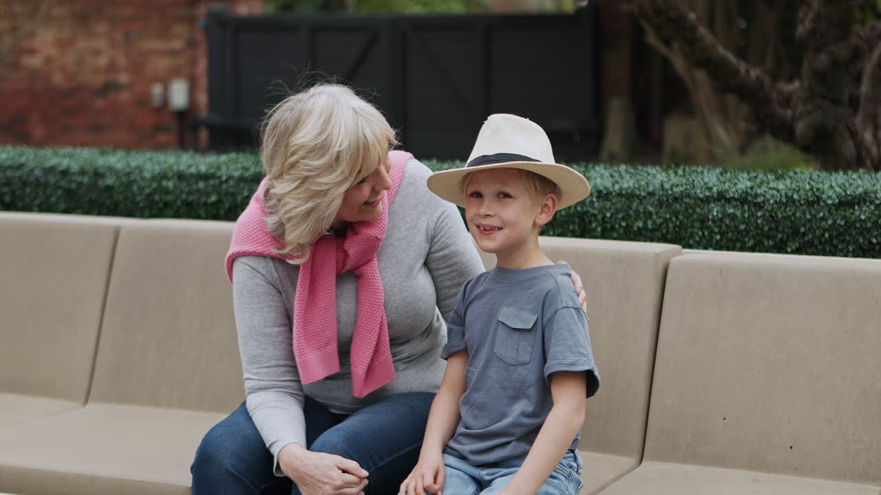 Grandmother and grandson on bench