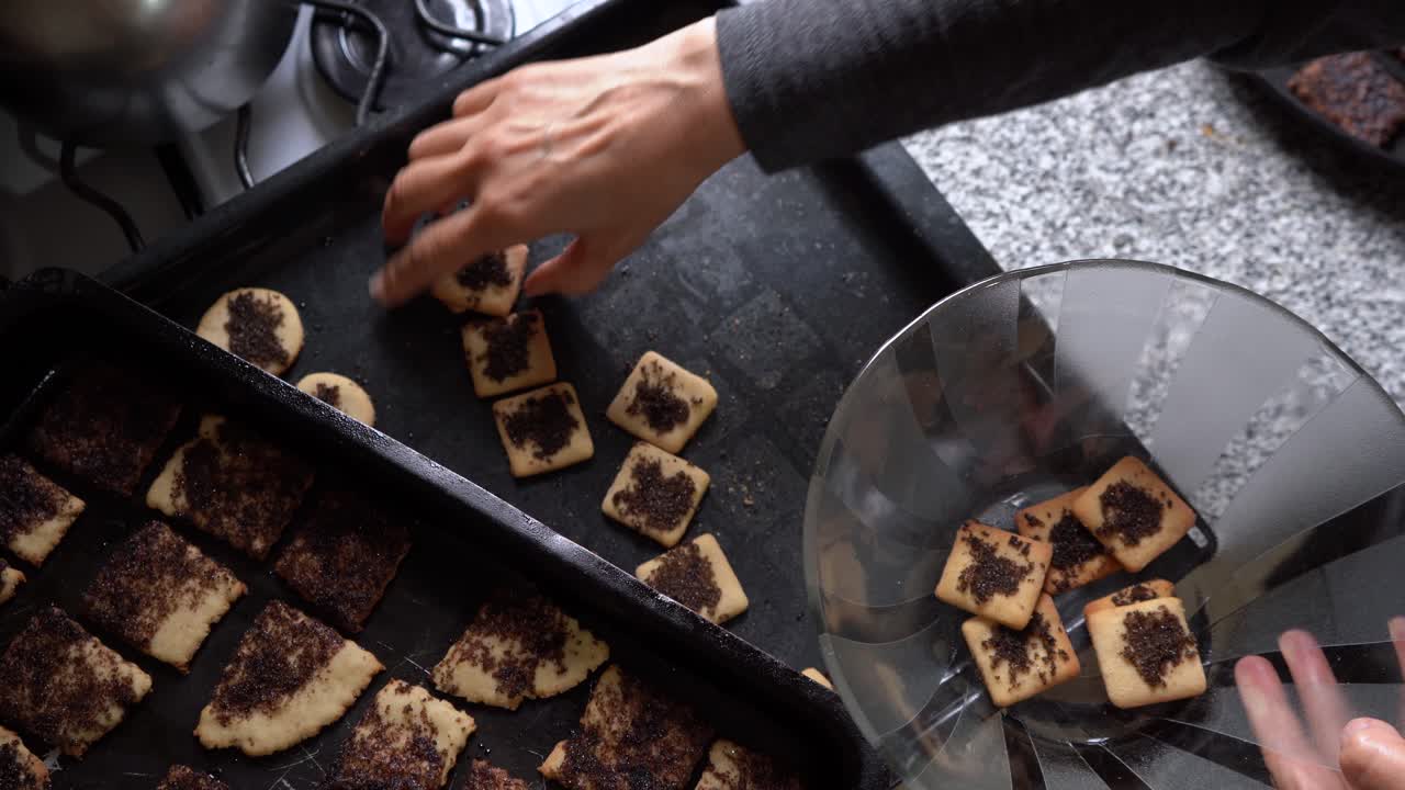 Baker Placing Freshly Baked Pastry In Clear Bowl - close up shot