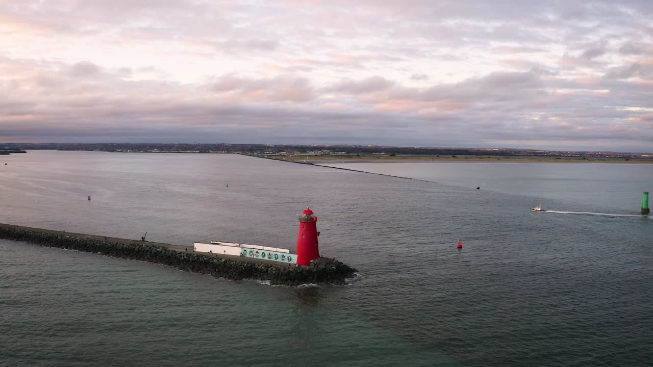 Aerial View of a Red Lighthouse at Sunset