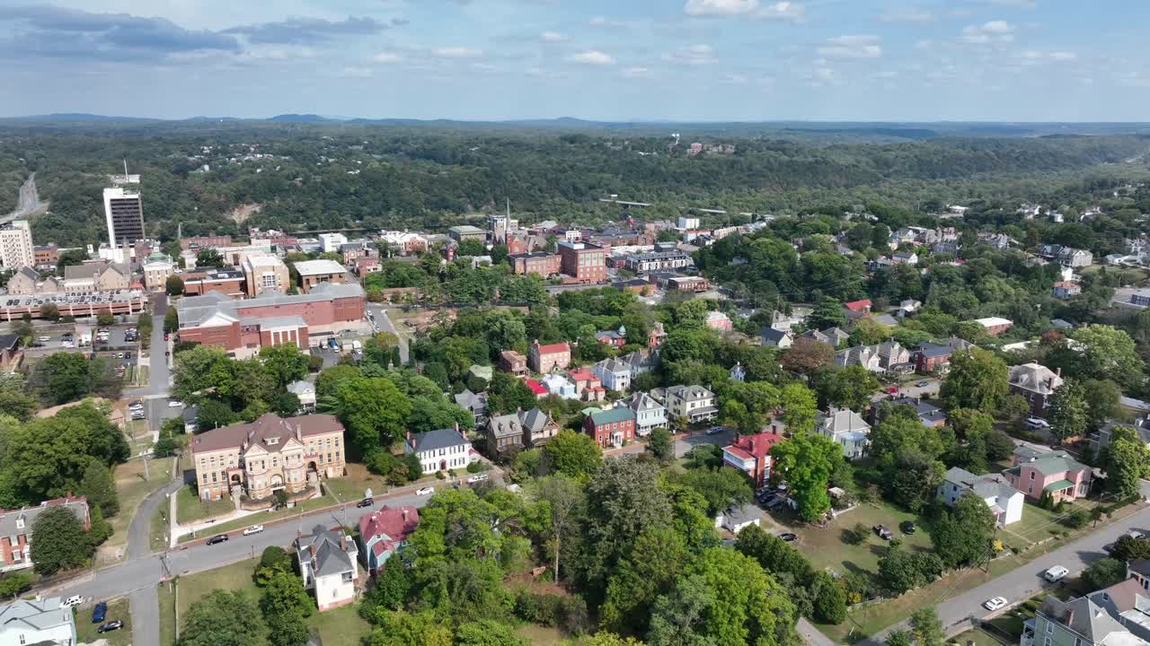 Downtown of Lynchburg with towers and historic villa housework Victorian style. Sunny summer day in America. Aerial wide shot. Virginia, USA