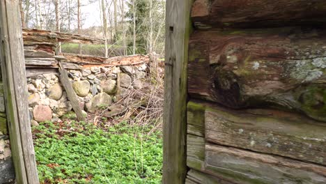 Walking-Towards-Abandoned-Place-With-Cobblestone-And-Weathered-Wooden-Fence