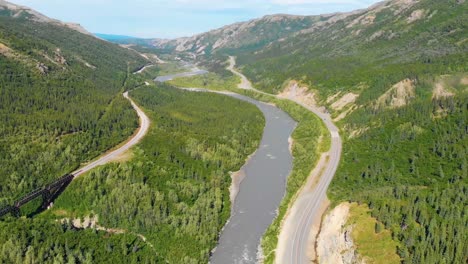 4k drone video of chulitna river, alaska railroad and parks highway route 3 near denali national park and preserve, alaska during summer