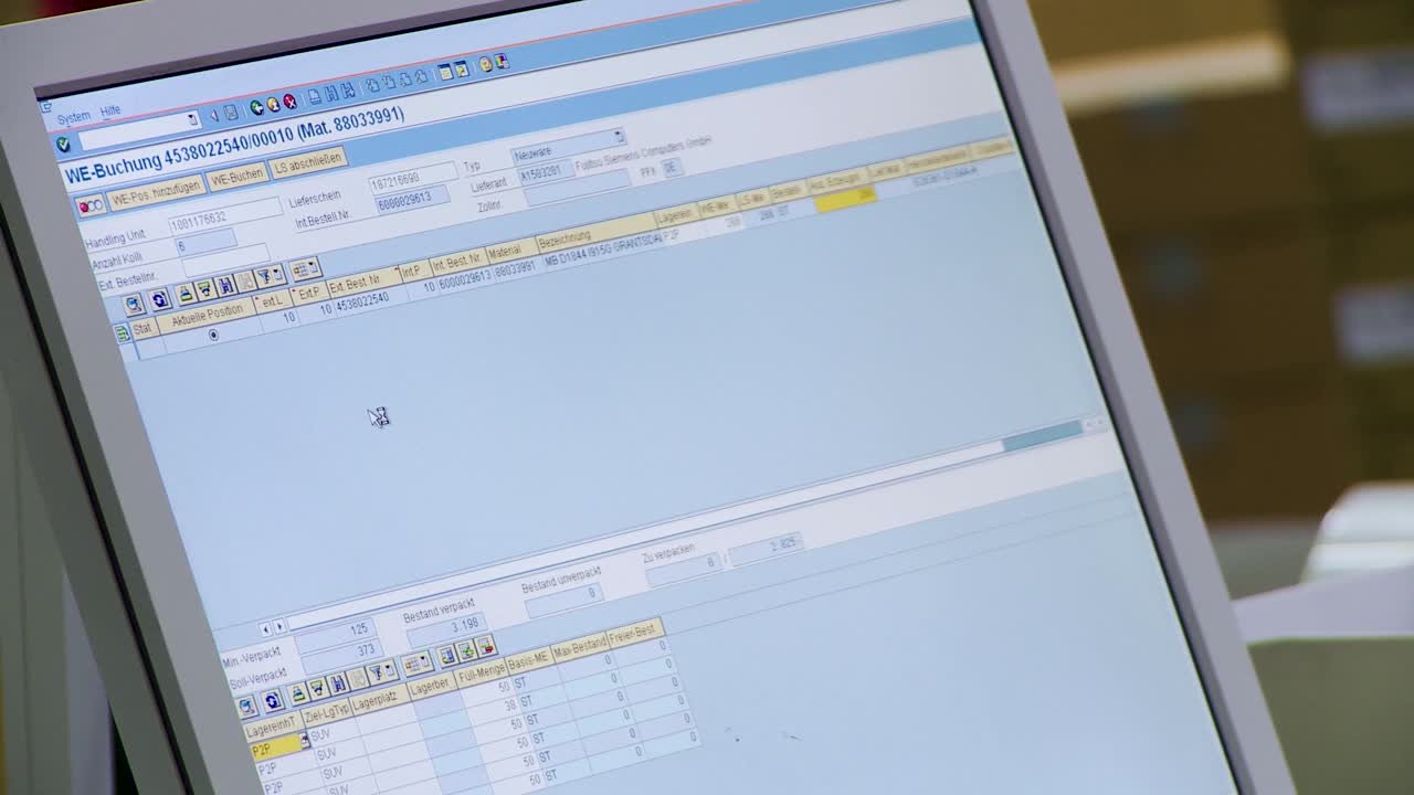 Computer screen showing software interface in an office environment