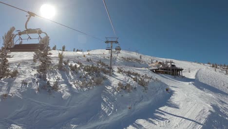 view from a ski lift to another ski lift between slopes