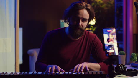 artist teaching online piano lessons from his home studio