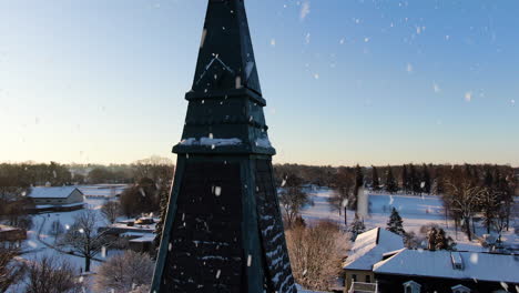 AERIAL-Pedestal-Up-Over-Historic-Church-Steeple,-CLOSE-UP