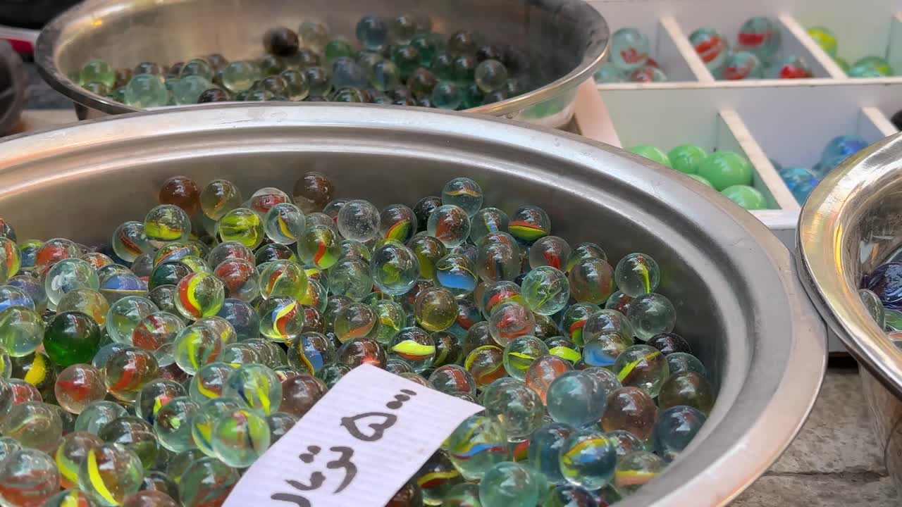 Traditional colorful glass marbles kids playful toys the brilliant transparent childhood toy retro design round texture outdoor activity leisure lifestyle summer game decoration health sport USA Iran