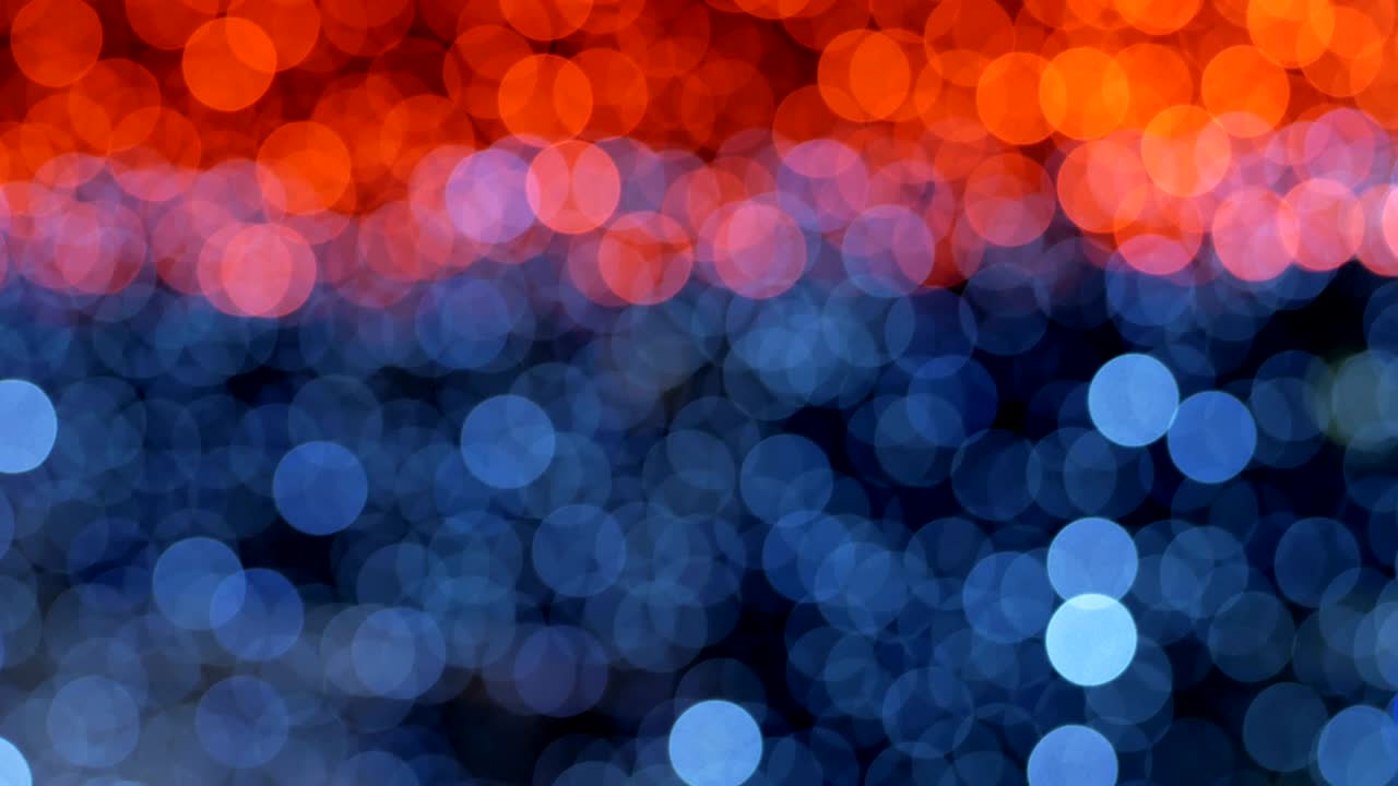 Night abstract background is defocused with nice bokeh. Blurred Christmas Lights Bokeh. Pan across blur .
