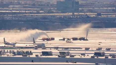 snow-clearing equipment removing snow at pearson airport in toronto, canada