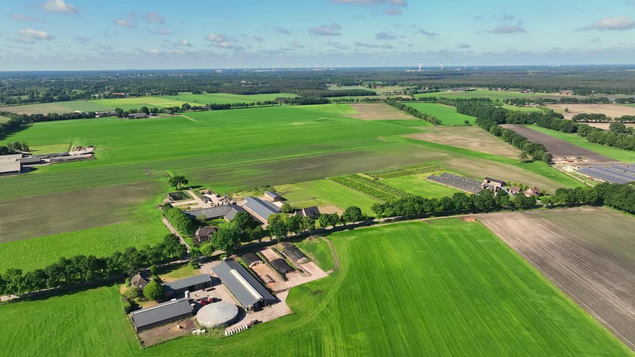 Aerial footage of agricultural farmland on a sunny day