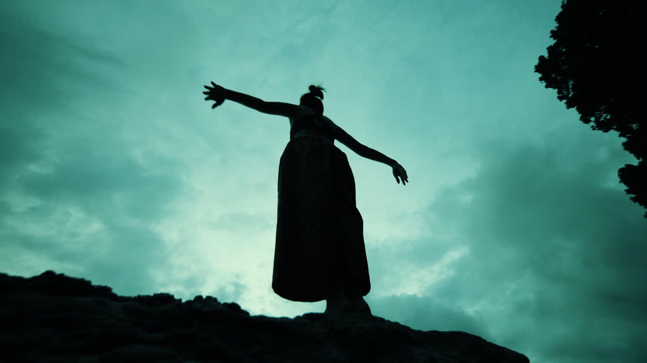 Woman Performing Aerial Silhouette in the Sky