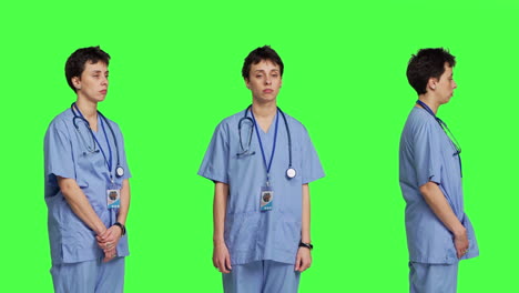 Displeased-nurse-saying-no-and-sighing-against-greenscreen-backdrop