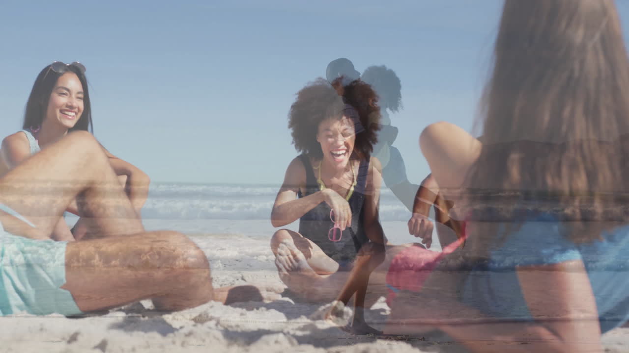 Relaxing on sandy beach, young people watching ocean waves and enjoying animation