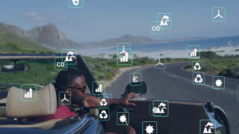 Driving convertible along coastal road, environmental impact icons animation over landscape
