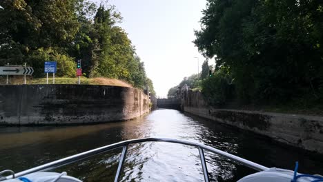 pov video off the front of a riverboat as to gets close to a lock on the river trent