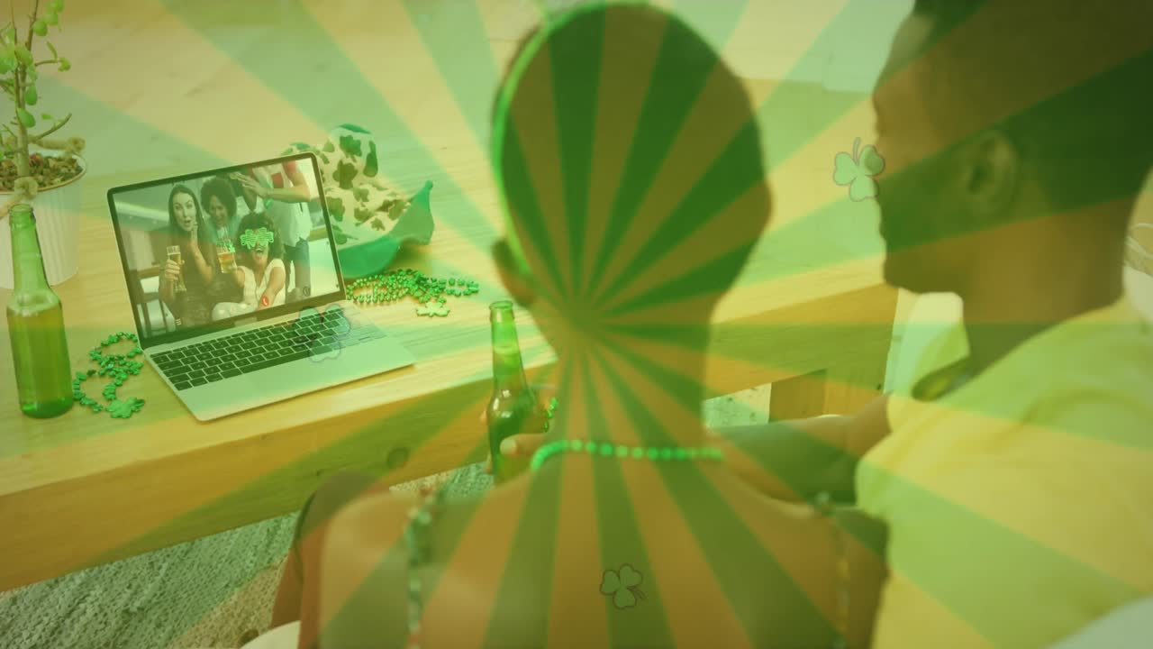 Animation of green stripes and couple celebrating st patrick's day with friends on laptop video call