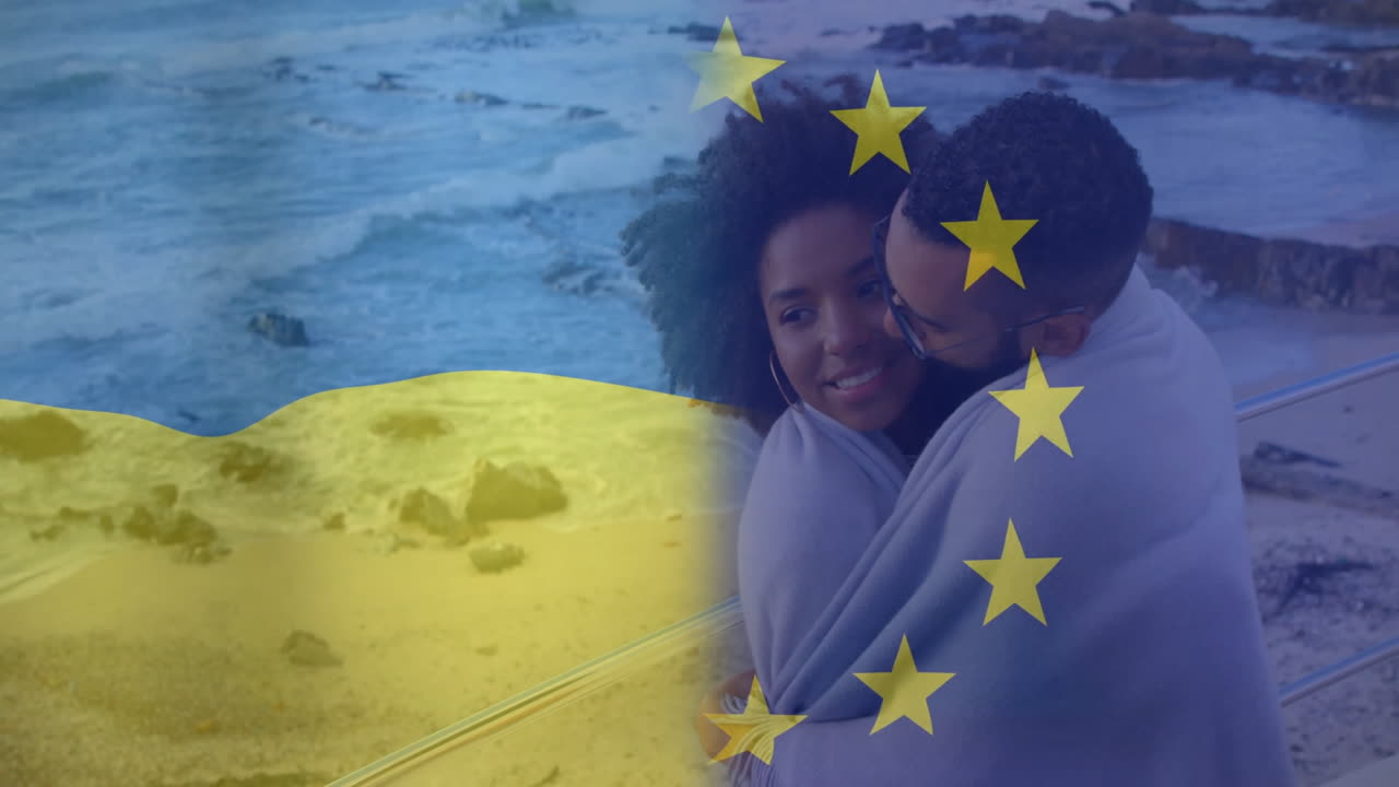 Embracing by ocean, couple with Ukraine and EU flags animation overlay