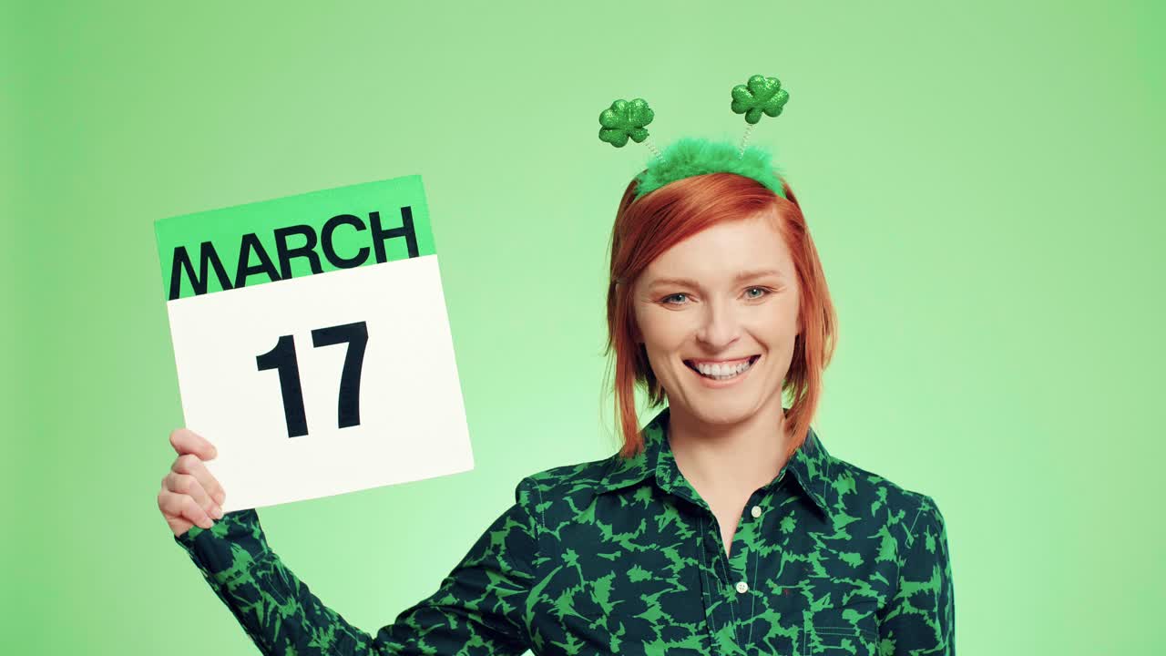 Woman showing calendar with a date for Saint Patrick's Day