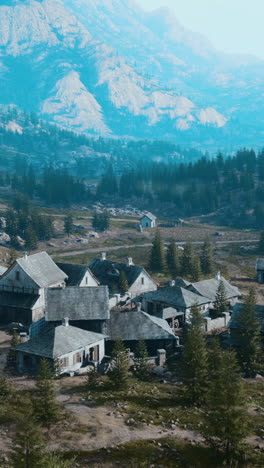 a picturesque village nestled in a valley surrounded by mountains and forest