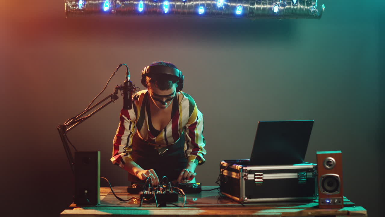 Cool performer mixing music and showing heart shape sign
