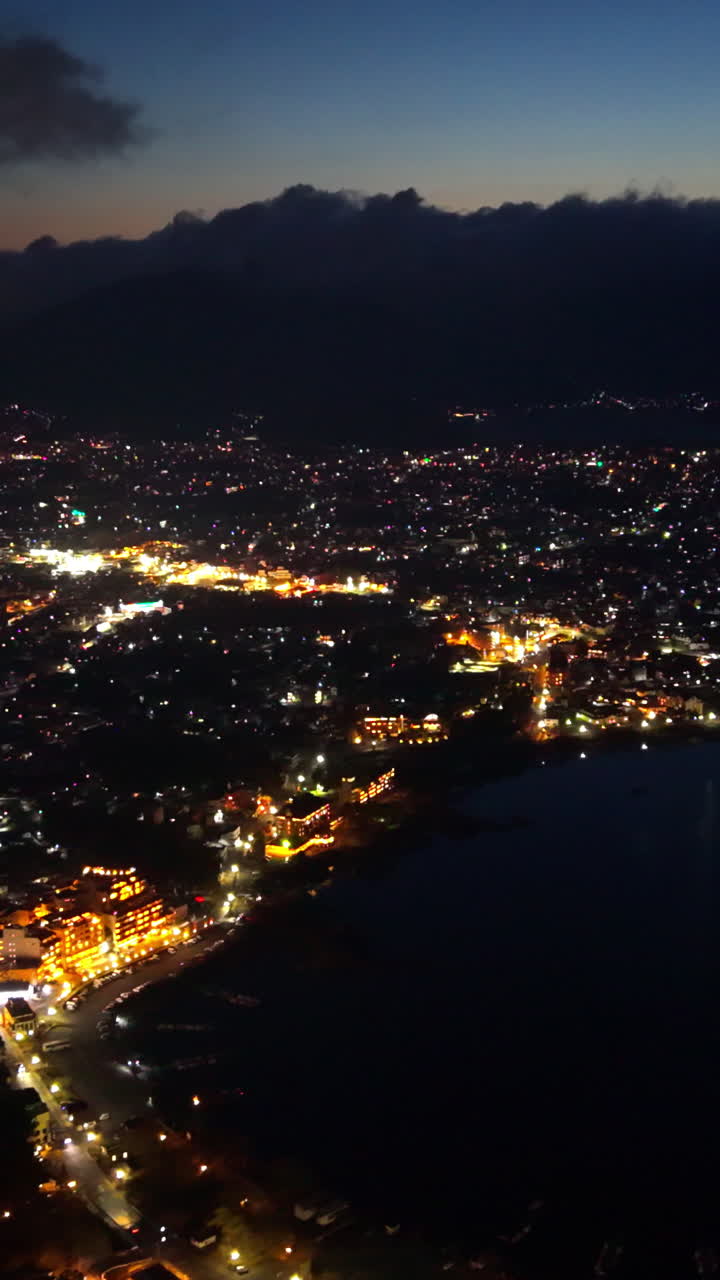 Aerial drone view of Lake Kawaguchiko near the Fujikawaguchiko town, Japan at night