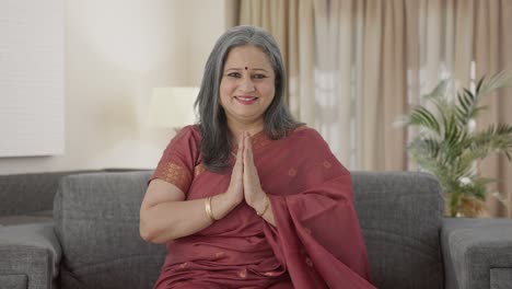 Happy-Indian-old-woman-greeting-and-doing-Namaste