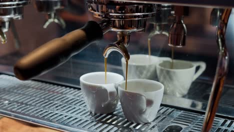 making double espresso coffee shot with professional coffee machine