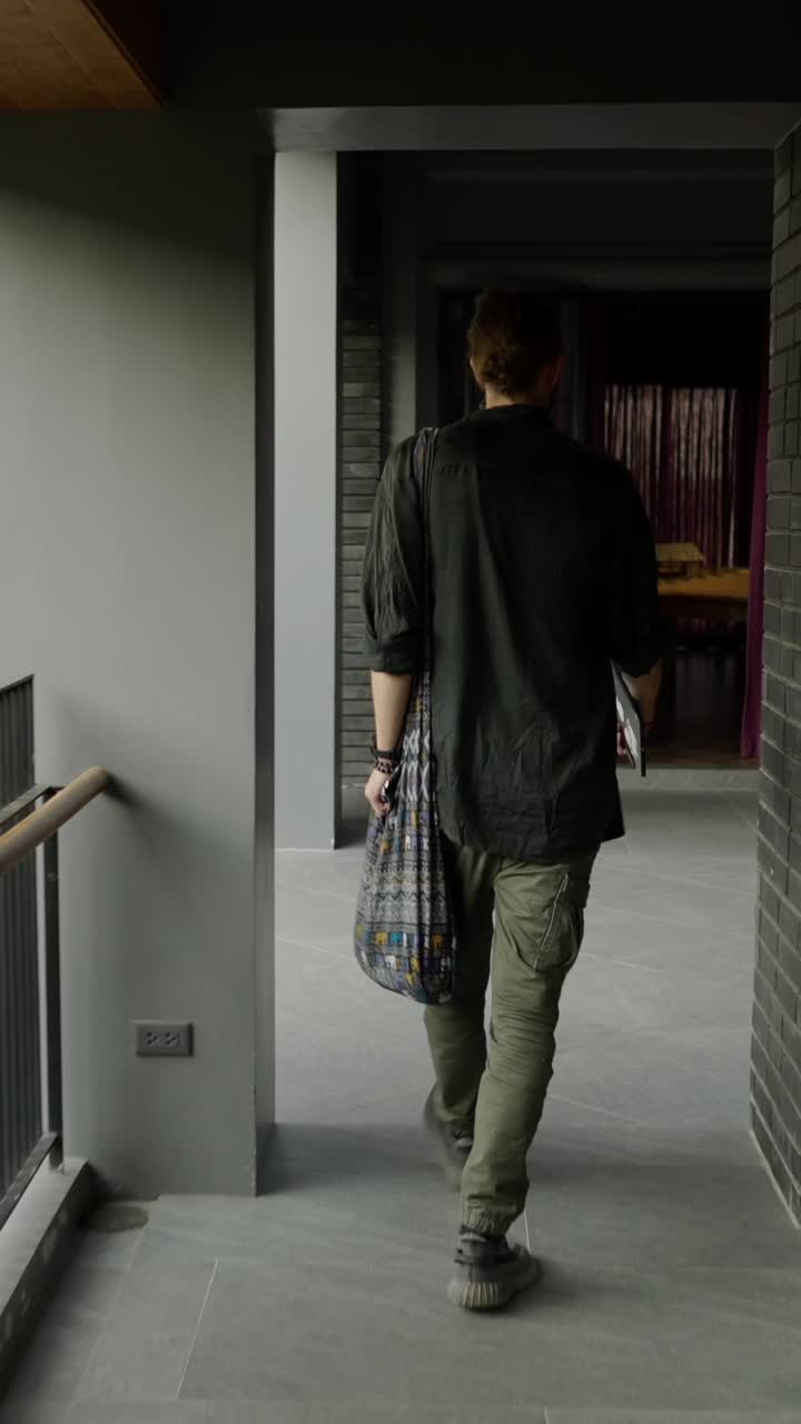 A person walking down a hallway