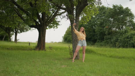 woman taking selfies outdoors, summer