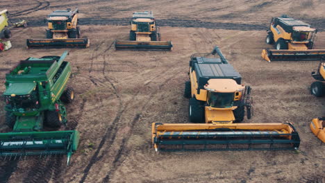 combine harvesters in a field