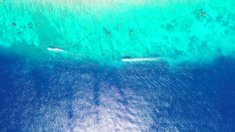 maui island, hawaii - a wonderful scenery of blue calm ocean with coral reefs - aerial shot